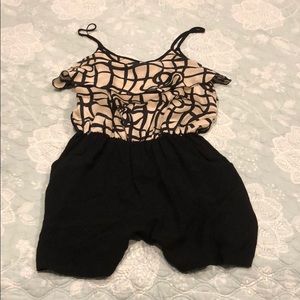 Cute black and champagne colored romper